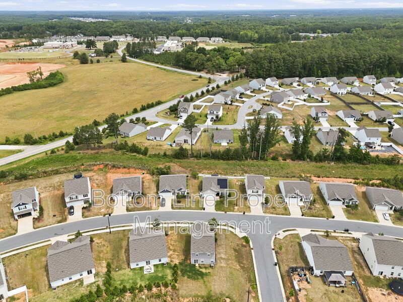 295 Windbreak Lane, Youngsville, NC 27596  $[Insert Listing Price] | 3 Bedrooms | 3 Bathrooms | 1,858 Sq Ft property image