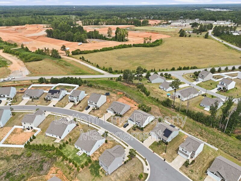 295 Windbreak Lane, Youngsville, NC 27596  $[Insert Listing Price] | 3 Bedrooms | 3 Bathrooms | 1,858 Sq Ft property image