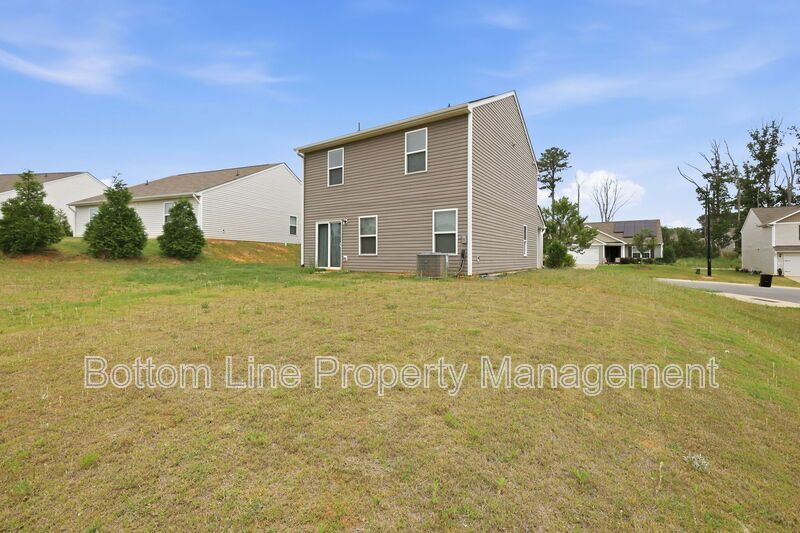 295 Windbreak Lane, Youngsville, NC 27596  $[Insert Listing Price] | 3 Bedrooms | 3 Bathrooms | 1,858 Sq Ft property image