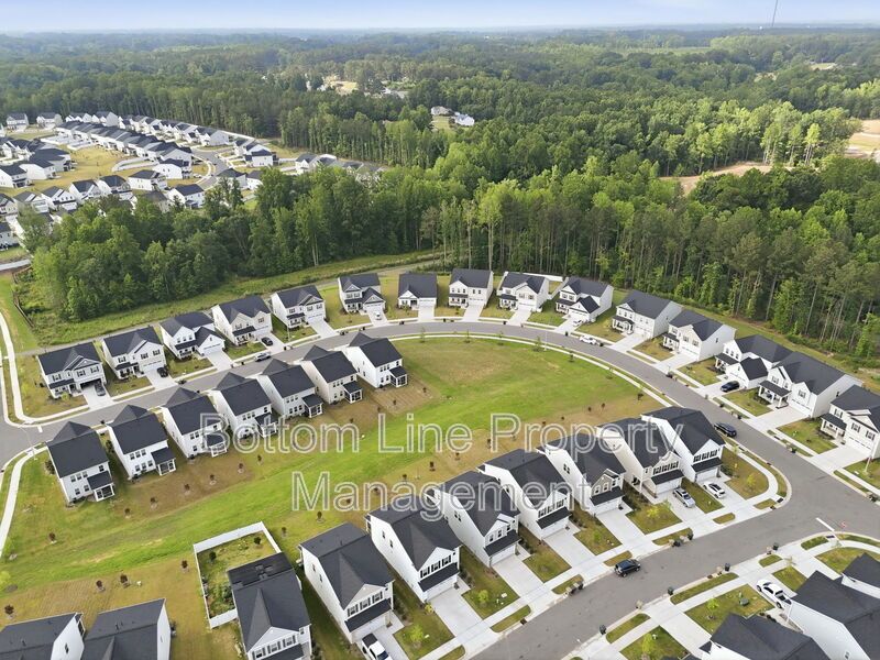 ✨ End-Unit Townhome with Designer Finishes, Screened Porch & Garage in Prime Durham Location property image