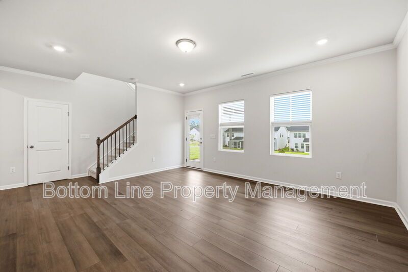 ✨ End-Unit Townhome with Designer Finishes, Screened Porch & Garage in Prime Durham Location property image
