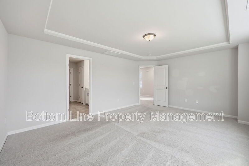 ✨ End-Unit Townhome with Designer Finishes, Screened Porch & Garage in Prime Durham Location property image
