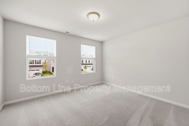 ✨ End-Unit Townhome with Designer Finishes, Screened Porch & Garage in Prime Durham Location property image