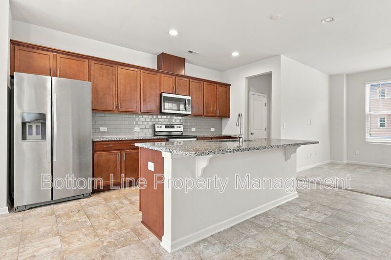 Room to Relax!  Spacious 2BR Apex End-Unit Townhome with Game Room & Garage property image