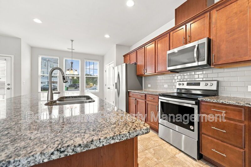 Room to Relax!  Spacious 2BR Apex End-Unit Townhome with Game Room & Garage property image