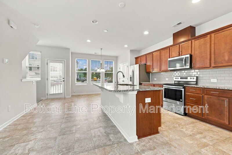 Room to Relax!  Spacious 2BR Apex End-Unit Townhome with Game Room & Garage property image