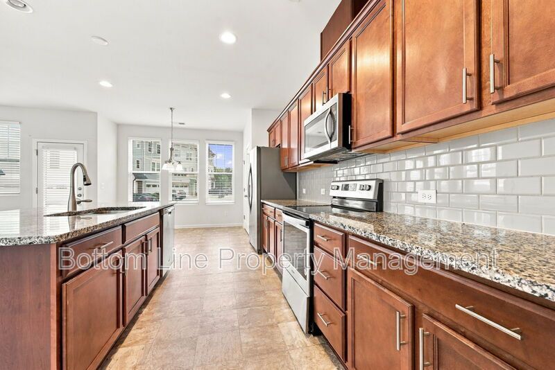 Room to Relax!  Spacious 2BR Apex End-Unit Townhome with Game Room & Garage property image