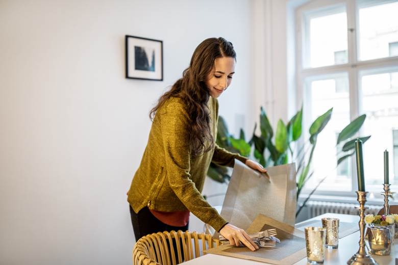 Woman setting table